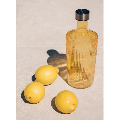 Paveau vandflaske i glas med låg i den gule farve Cable.