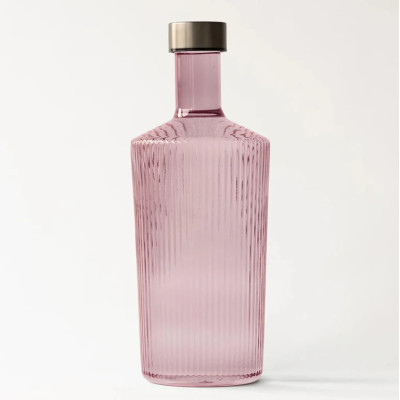 Paveau vandflaske i rillet farvet glas gammelrosa.